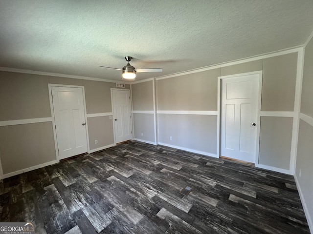 spare room with crown molding, a textured ceiling, dark hardwood / wood-style floors, and ceiling fan