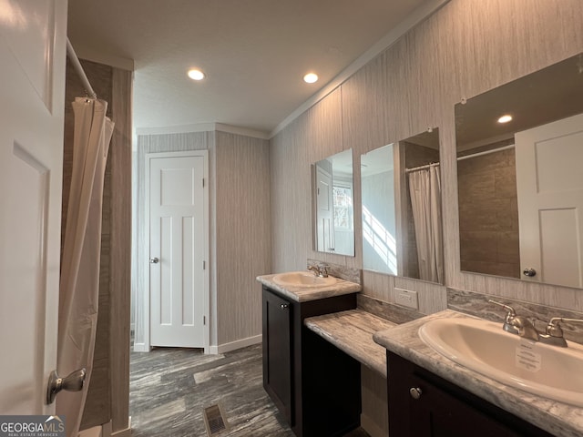 bathroom with hardwood / wood-style flooring and vanity