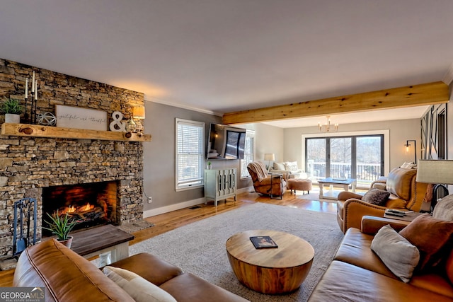 520 Long View Dr, Hiawassee, GA 30546 - living area featuring a stone fireplace, wood finished floors, crown molding, baseboards, and a chandelier