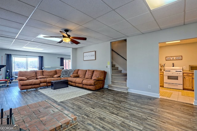 520 Long View Dr, Hiawassee, GA 30546 - living area with a ceiling fan, wood finished floors, stairway, a paneled ceiling, and baseboards