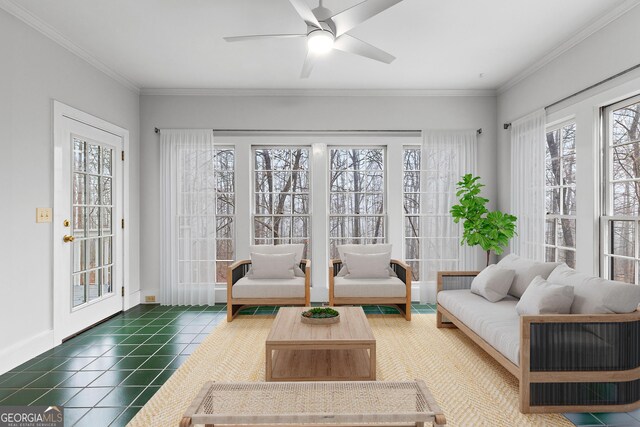 unfurnished living room featuring ornamental molding, hardwood / wood-style floors, ceiling fan, and a fireplace