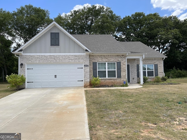 view of front facade with a garage and a front yard