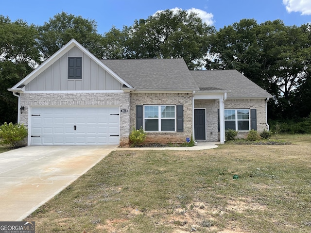 view of front of house with a garage and a front lawn