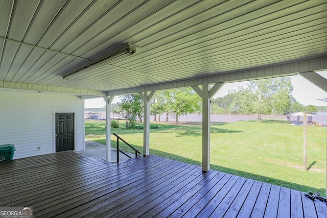 wooden deck featuring a yard