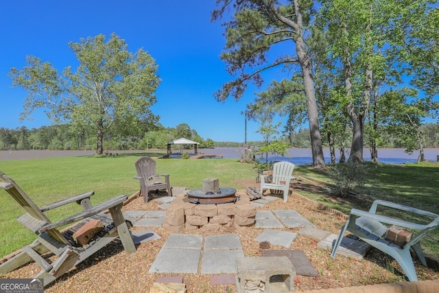 view of patio / terrace with a gazebo and a water view