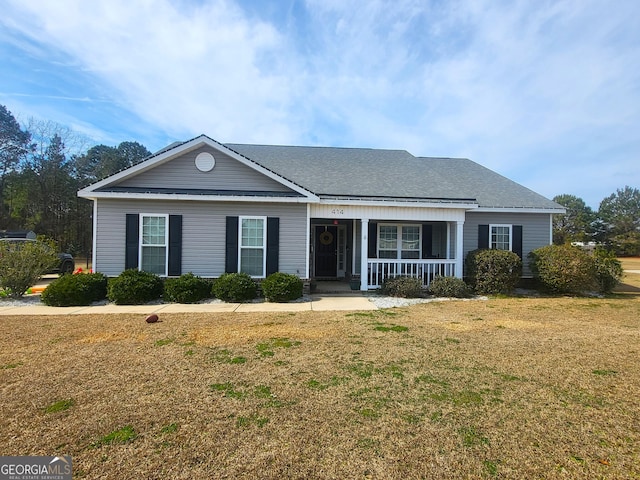 single story home with a front yard and a porch