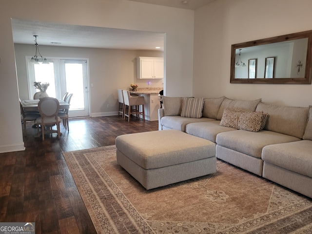 living room with dark hardwood / wood-style floors