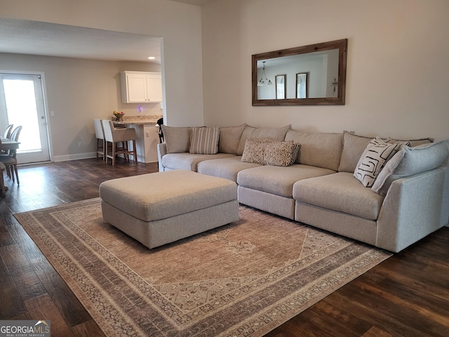 living room featuring dark wood-type flooring