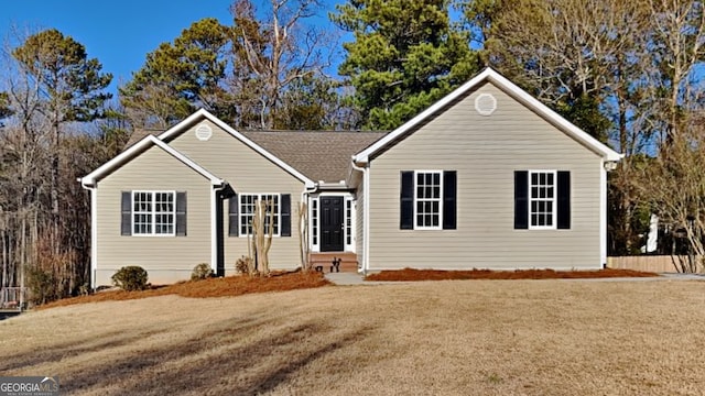 single story home featuring a front yard