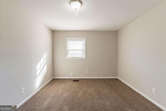 empty room with carpet floors