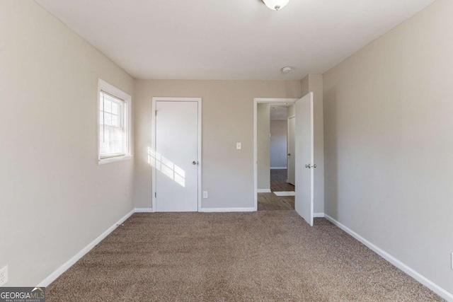 unfurnished bedroom with carpet floors