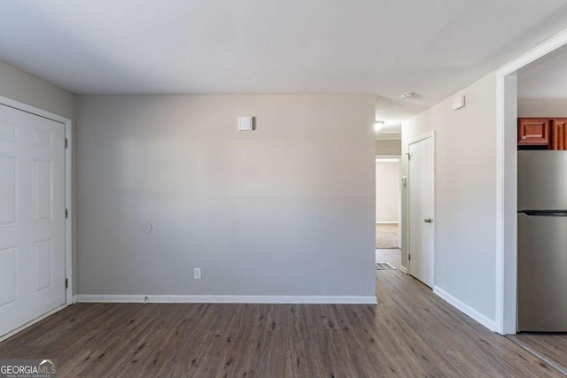 empty room with wood-type flooring