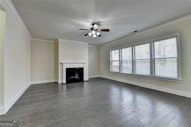 unfurnished living room featuring ceiling fan, ornamental molding, and dark hardwood / wood-style flooring