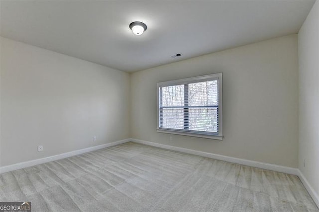 empty room with light colored carpet