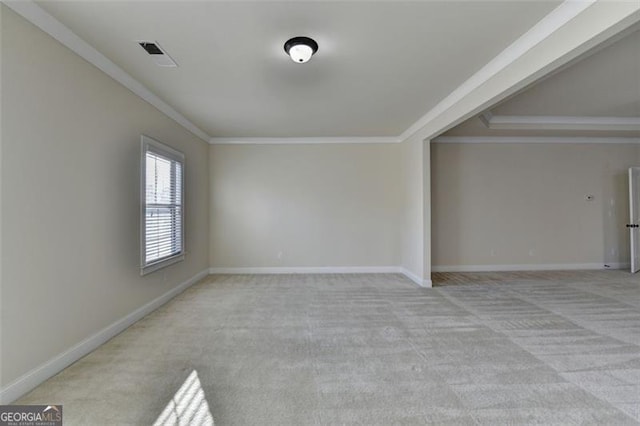 carpeted spare room with ornamental molding