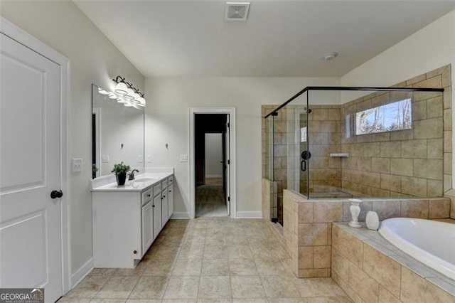 bathroom with tile patterned floors, vanity, and separate shower and tub