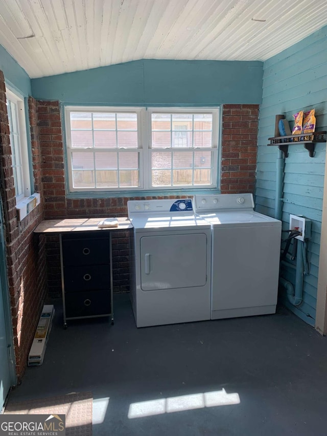 1102 Phillips St, Augusta, GA 30901 - clothes washing area featuring brick wall, wooden ceiling, and washer and clothes dryer
