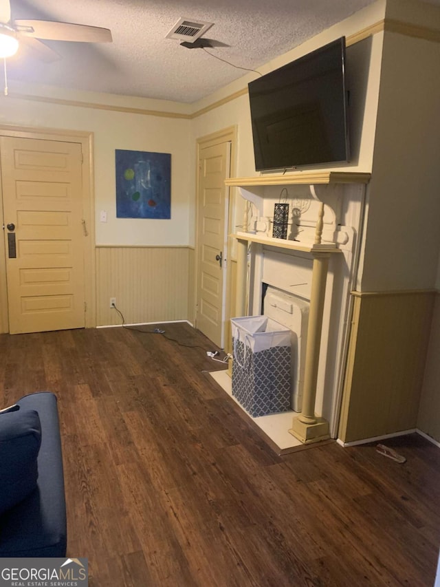 1102 Phillips St, Augusta, GA 30901 - living room featuring dark wood-type flooring, ceiling fan, and a textured ceiling
