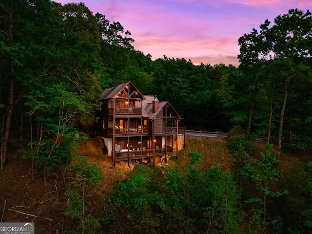 273 Deer Crest Hts, Blue Ridge, GA 30513 - back house at dusk with a balcony