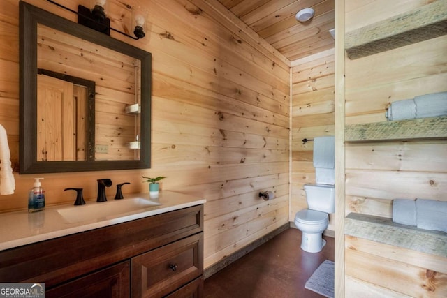 273 Deer Crest Hts, Blue Ridge, GA 30513 - bathroom featuring vanity, toilet, concrete flooring, and wood walls