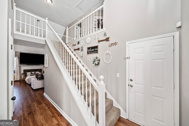 stairway featuring wood-type flooring