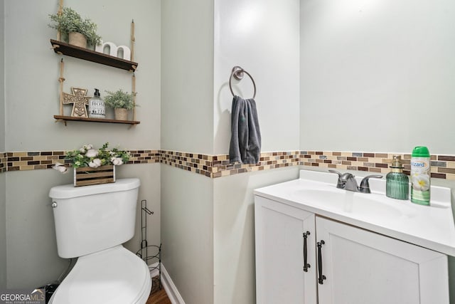 bathroom with vanity and toilet