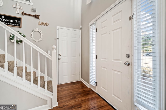 entrance foyer featuring dark hardwood / wood-style floors