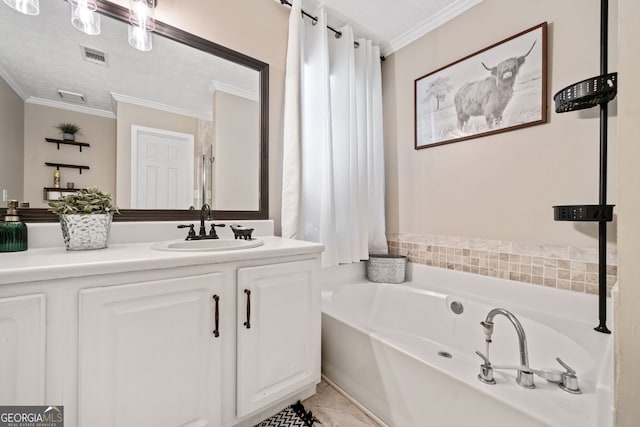 bathroom featuring ornamental molding, a bathtub, vanity, and a textured ceiling