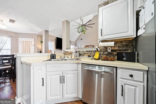 kitchen featuring stainless steel appliances, white cabinetry, and sink