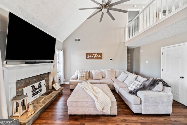 living room with ceiling fan, dark hardwood / wood-style floors, and high vaulted ceiling