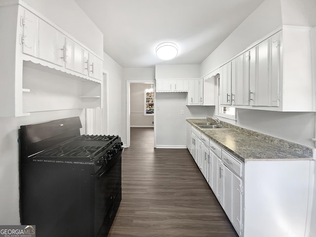 kitchen with white cabinetry, sink, black range with gas stovetop, and dark hardwood / wood-style flooring