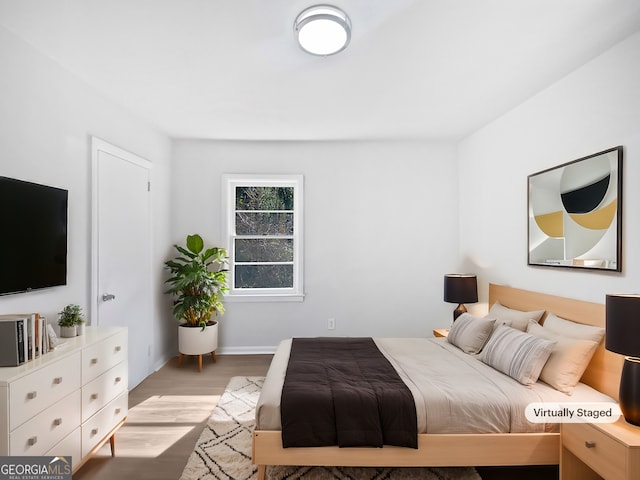 bedroom featuring light hardwood / wood-style flooring