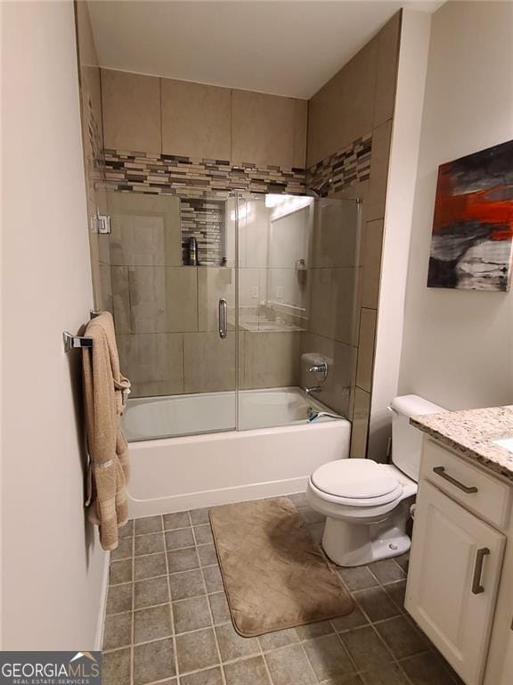 full bathroom with enclosed tub / shower combo, vanity, toilet, and tile patterned flooring