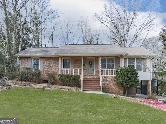 view of front of property with a porch and a front lawn