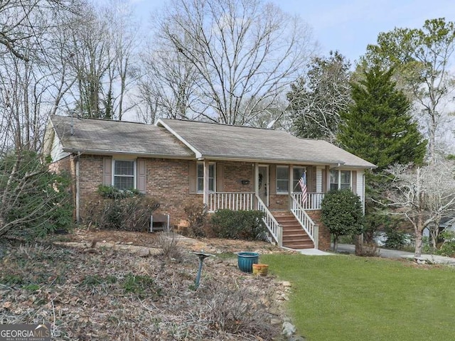 ranch-style house featuring a front yard and a porch