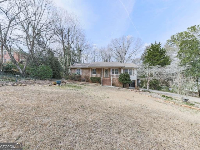 ranch-style home featuring covered porch