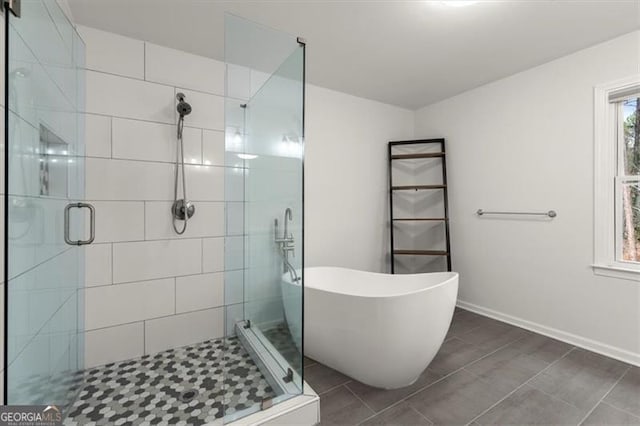 bathroom with tile patterned flooring and plus walk in shower