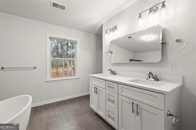 bathroom with vanity and a bathtub