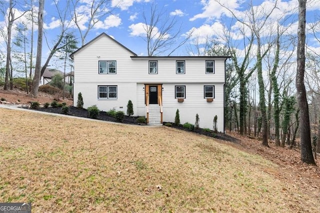 front facade featuring a front yard