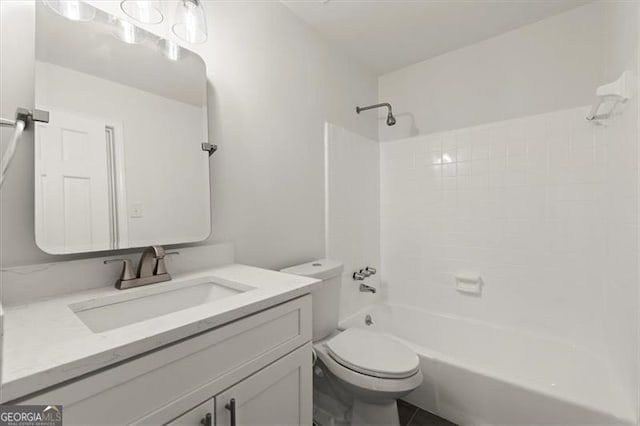 full bathroom featuring vanity, toilet, and  shower combination