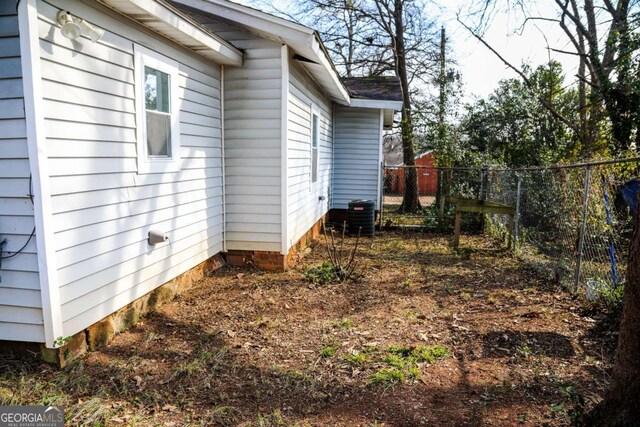 view of yard featuring central AC unit