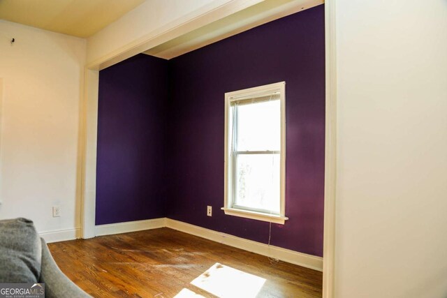 empty room featuring wood-type flooring