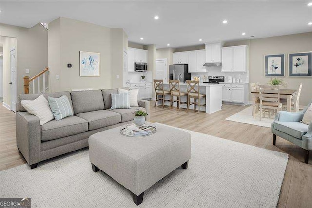 living room with light hardwood / wood-style floors