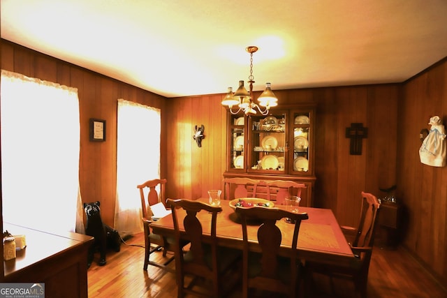 427 Oak Hill Dr, Trion, GA 30753 - dining area with a chandelier, wood finished floors, and wood walls