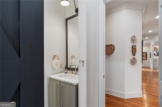 bathroom featuring vanity and hardwood / wood-style floors