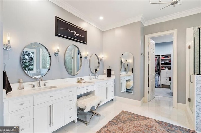 bathroom featuring a shower with door, ornamental molding, and vanity