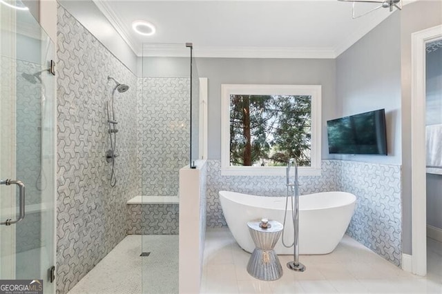 bathroom featuring ornamental molding, separate shower and tub, and tile walls