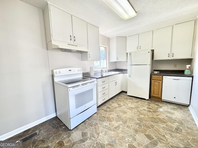 kitchen with sink, a textured ceiling, white cabinets, and white appliances