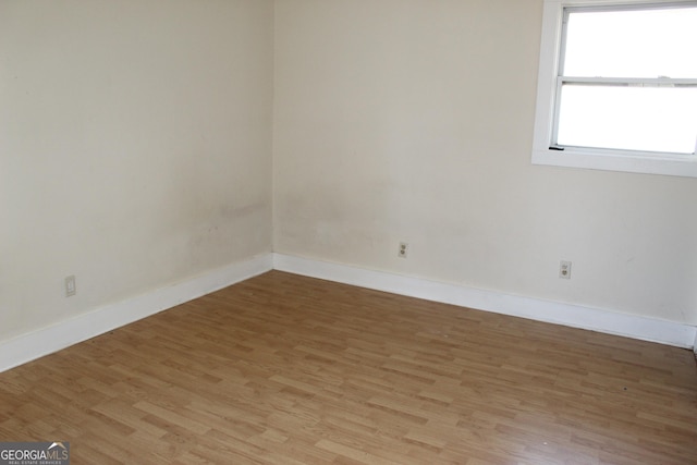 spare room featuring light wood-type flooring