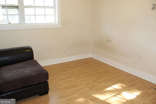 sitting room with light hardwood / wood-style flooring